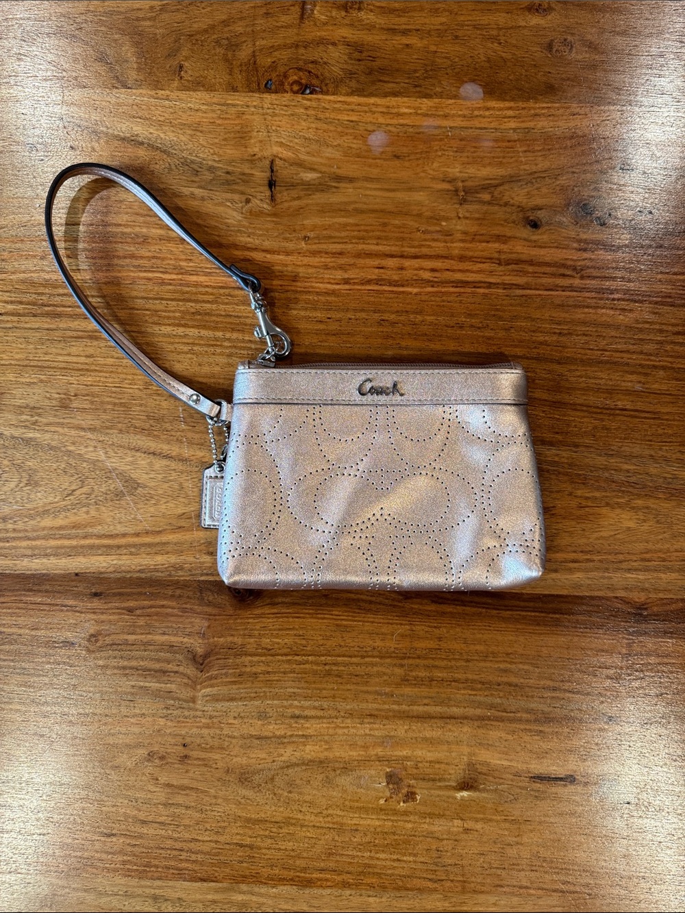 Coach Metallic Rose Gold Perforated Wristlet